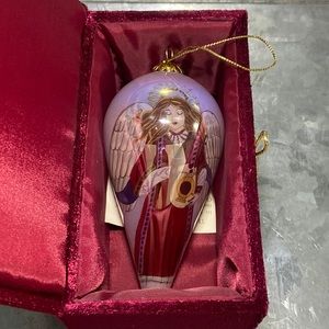 The “Li Bien” Angel Ornament. Hand painted Brown hair angel wearing a red gown